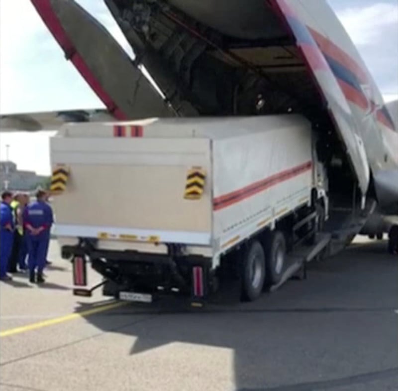 A Russian Emergencies Ministry's truck with humanitarian aid drives into a cargo plane heading to Beirut. REUTERS