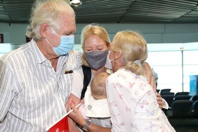 Alexandra Harg and baby Hazel (middle) arrive from Sydney to be reunited with Hazel's Grandparents Rob and Maja Fyfe at Brisbane Domestic Airport, Brisbane, Australia, on December 13, 2021. EPA