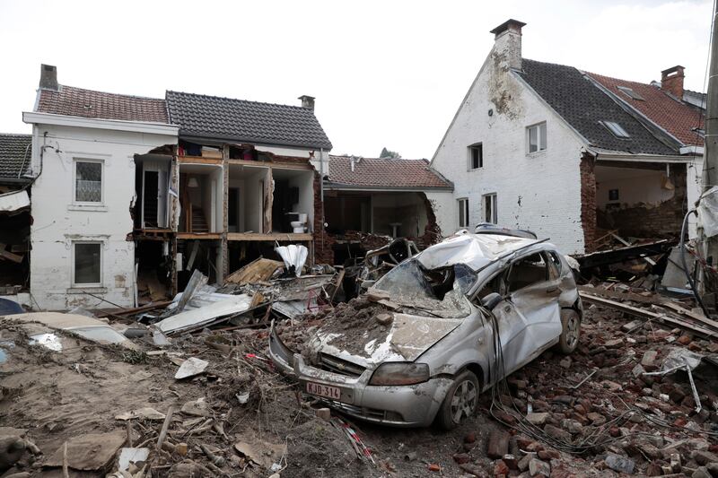 Damaged houses and cars in Pepinster, Belgium.