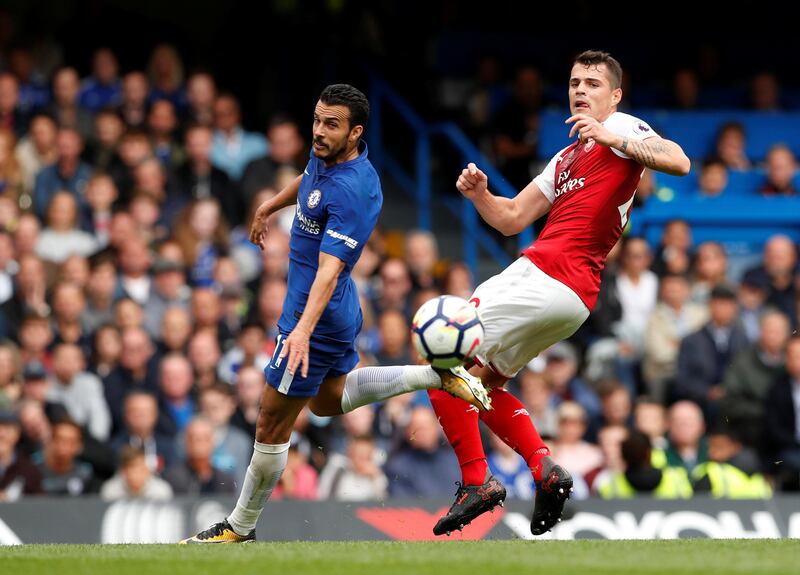 Chelsea's Pedro in action with Arsenal's Granit Xhaka. John Sibley / Reuters