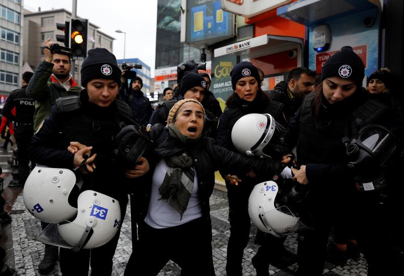 Riot police detain a demonstrator during a protest against Turkey's military operation in Syria's Afrin region, in Istanbul, Turkey January 21, 2018. REUTERS/Umit Bektas