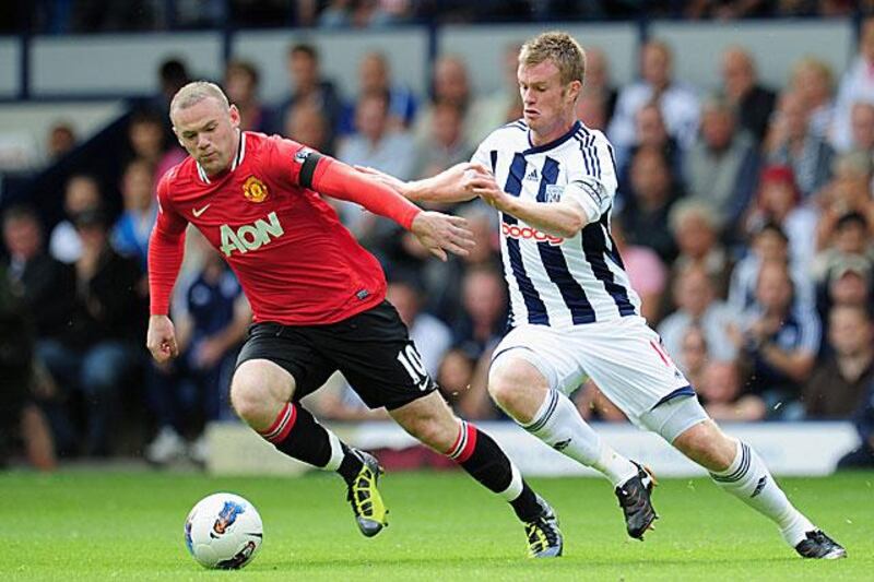 A new-look Wayne Rooney, left, fends off Chris Brunt. Rooney put United ahead after 12 minutes before a howler from David De Gea when he dived over WBA striker Shane Long's shot levelled matters.

Shaun Botterill / Getty Images