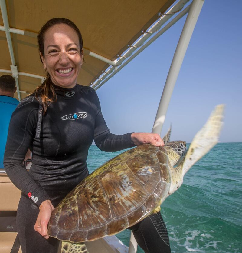 Jimena Rodriquez with one of the turtles she helped track in UAE waters. Courtesy: Emirates Nature - WWF