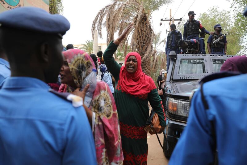 Family members of ousted Sudanese President Omar al-Bashir, who is on trial along with 27 co-accused, protest outside a courthouse in Khartoum, Sudan. AP Photo