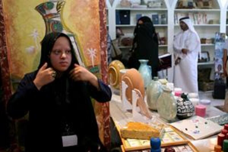 Badriyah Essah displays her handicrafts at the new shop in Al Arsa souk.