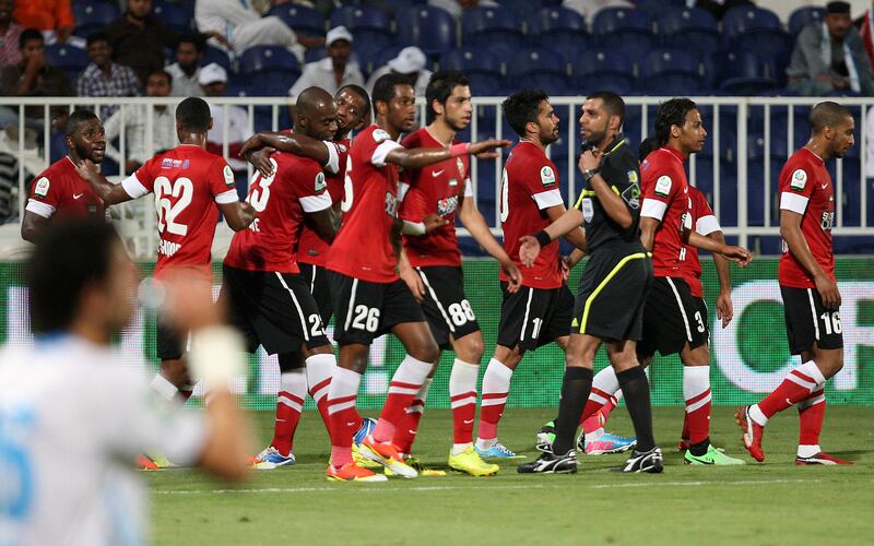 ABU DHABI , UNITED ARAB EMIRATES Ð April 15 , 2013 : Grafite ( no 23 in red 3rd from left ) of Al Ahli celebrating after scoring the second goad in the Etisalat Pro - League football match between Bani Yas vs Al Ahli at Baniyas stadium in Abu Dhabi. ( Pawan Singh / The National ) For Sports
