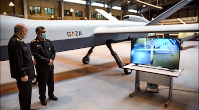 This handout photo provided by Iran's Revolutionary Guard Corps (IRGC) official website via SEPAH News on May 21, 2021, shows General Hossein Salami (L) and Amir Ali Hajizadeh commander of Aerospace Force of the IRGC, unveiling a new combat drone called "Gaza" in tribute to Palestinians, in the capital Tehran, hours after a ceasefire between Israel and Palestinian armed factions took effect. The drone is capable of carrying 13 bombs while flying at over 35,000 feet, with a speed of almost 350 kilometres per hour for 20 hours, Salami said.
 - RESTRICTED TO EDITORIAL USE - MANDATORY CREDIT "AFP PHOTO / Iran's Revolutionary Guard via SEPAH NEWS" - NO MARKETING - NO ADVERTISING CAMPAIGNS - DISTRIBUTED AS A SERVICE TO CLIENTS
 / AFP / IRAN'S REVOLUTIONARY GUARDS WEBSITE / SEPAH NEWS / - / RESTRICTED TO EDITORIAL USE - MANDATORY CREDIT "AFP PHOTO / Iran's Revolutionary Guard via SEPAH NEWS" - NO MARKETING - NO ADVERTISING CAMPAIGNS - DISTRIBUTED AS A SERVICE TO CLIENTS
