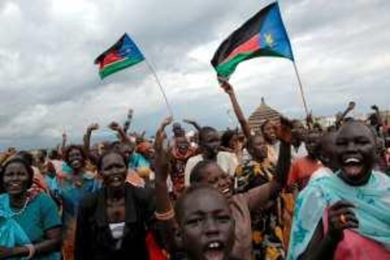 Residents of Abyei wave the Southern Sudan flag as they celebrate the Permanent Court of Arbitration's decision on the Abyei boundary on July 22, 2009.  North and south Sudan have accepted the international arbitration court ruling altering the borders of the disputed oil-rich Abyei region, officials from the former foes said.

==RESTRICTED TO EDITORIAL USE===