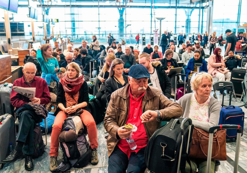 Travellers wait during a strike of Scandinavian Airlines' (SAS) pilots to contest wages and working hours on April 26, 2019 at the Gardamoen Airport in Oslo, Norway.
 Pilots at SAS walked off the job in Sweden, Denmark and Norway, stranding 70,000 travellers as more than 300 flights were cancelled, the airline said. Domestic, European and long-haul flights were all affected by the strike, it  said, predicting that a total of 170,000 passengers would be affected through April 28, 2019. - Norway OUT
 / AFP / NTB Scanpix / Ole Berg-Rusten
