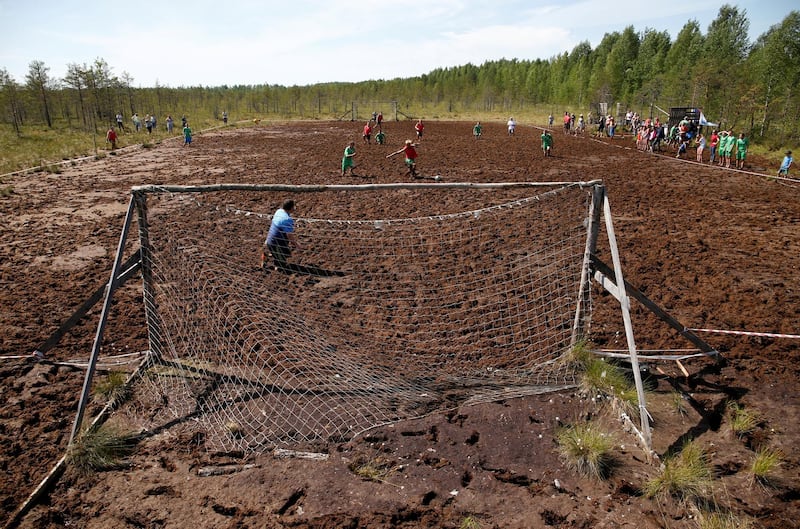 Soccer enthusiasts compete in the Swamp Football Cup of Russia in the village of Pogi in Leningrad Region, Russia. Anton Vaganov / Reuters