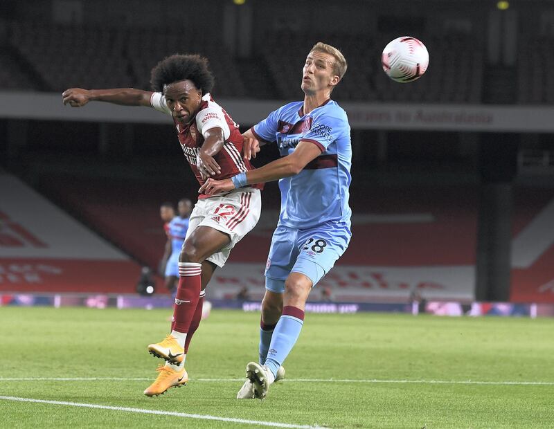 LONDON, ENGLAND - SEPTEMBER 19: Willian of Arsenal challenged by Tomas Soucek of West Ham during the Premier League match between Arsenal and West Ham United at Emirates Stadium on September 19, 2020 in London, England. (Photo by Stuart MacFarlane/Arsenal FC via Getty Images)