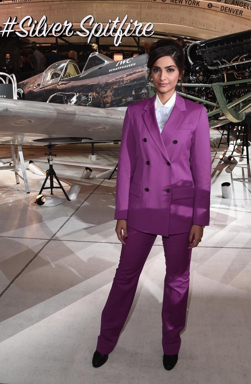 And a masculinely tailored bright purple Calvin Klein suit: she's never averse to taking a style risk.