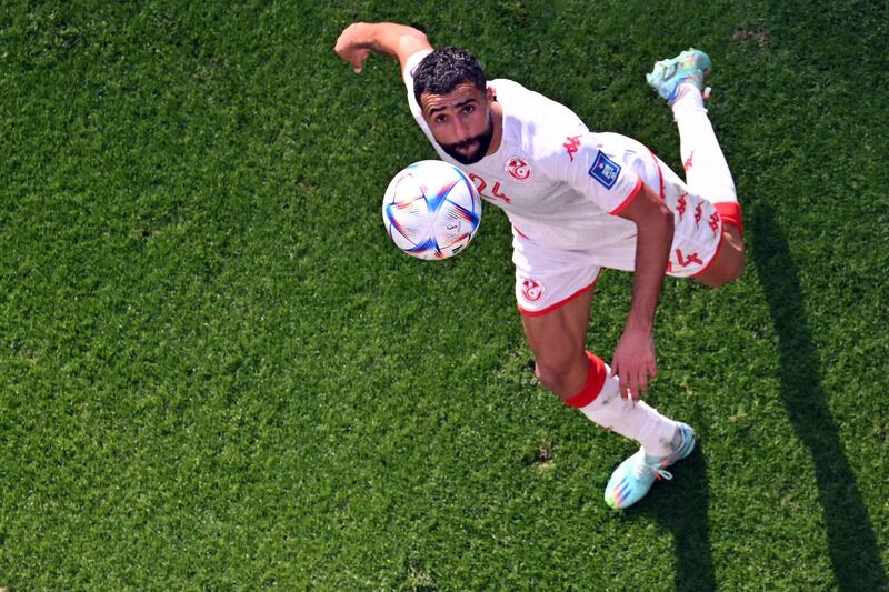 Tunisia's defender Ali Abdi eyes the ball. AFP