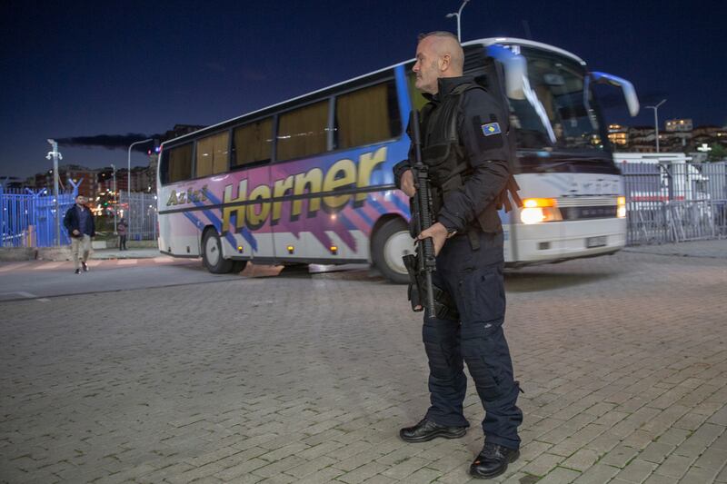 A Kosovo police officer secures the area at the Fadil Vokrri Stadium in Pristina, Kosovo as the Israeli national team arrive for a Euro 2024 Group I qualifier on Sunday, November  12, 2023. AP