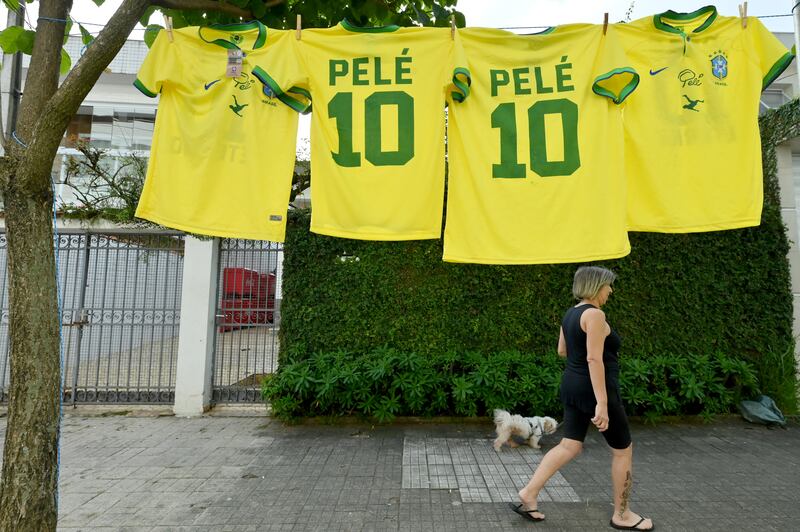 Pele jerseys outside the Urbano Caldeira Stadium ahead of the football legend's wake and funeral. Getty