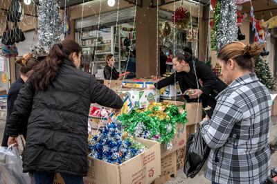 Women shop for Christmas decorations in Qaraqosh, Iraq, 20 December 2017.