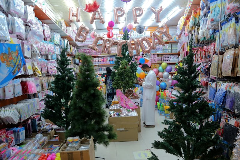 People buy decorations from a shop selling various items for Christmas celebrations, after the government eased restrictions on the sale of Christmas ornaments and decorations, in Riyadh, Saudi Arabia.  Reuters