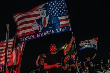 Suppoerters of former US President Donald Trump stand outside his residence residence in Mar-A-Lago, Florida on August 8, 2022.  - Former US president Donald Trump said August 8, 2022 that his Mar-A-Lago residence in Florida was being "raided" by FBI agents in what he called an act of "prosecutorial misconduct. " (Photo by Giorgio VIERA  /  AFP)