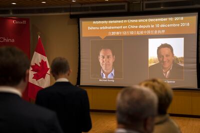 Images of Canadians Michael Kovrig and Michael Spavor are displayed at an event held at the Canadian embassy in Beijing in connection with the announcement of the latter's sentence. AP
