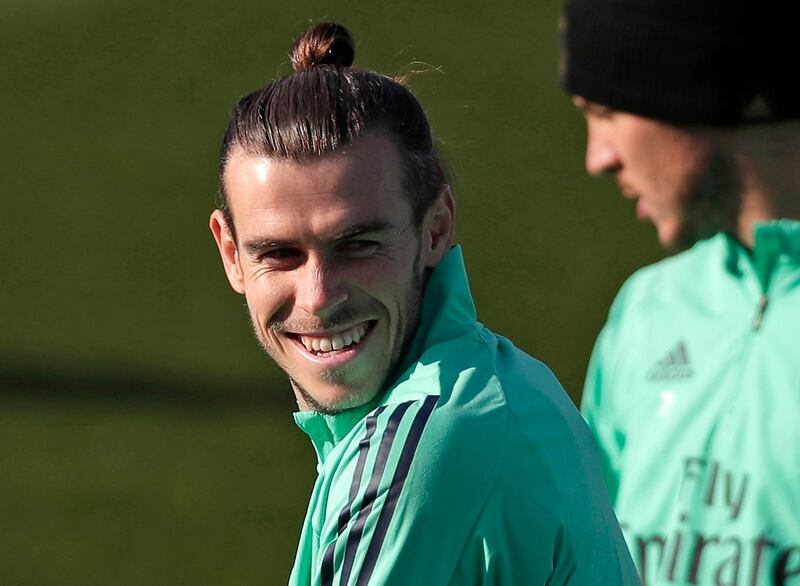 FILE - In this Monday, Nov. 25, 2019 file photo, Real Madrid's Gareth Bale takes part in a training session at the team's Valdebebas training ground in Madrid, Spain. Out of favor at Real Madrid, Gareth Bale is hoping to secure a return to Premier League club Tottenham. Bale's agent, Jonathan Barnett, confirmed to The Associated Press that he is in talks with Tottenham Hotspur. (AP Photo/Manu Fernandez, File)