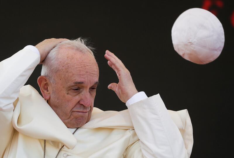A gust of wind blows Pope Francis's skull cap off during his pastoral visit in Alessano, southern Italy. Reuters / Max Rossi.
