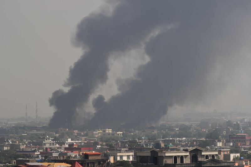 TOPSHOT - Smoke rises from the site of an attack after a massive explosion the night before near the Green Village in Kabul on September 3, 2019. A massive blast in a residential area of Kabul killed at least 16 people, officials said on September 3, yet another Taliban attack that came as the insurgents and Washington try to finalise a peace deal. / AFP / Wakil KOHSAR
