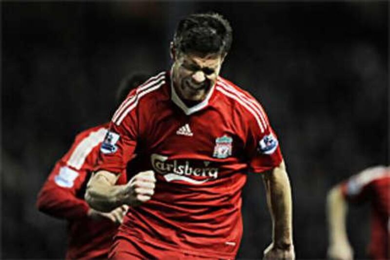 Xabi Alonso celebrates his goal for Liverpool.
