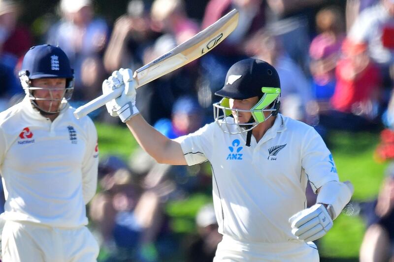 New Zealand's BJ Watling (R) celebrates 50 runs during day two of the second cricket Test match between New Zealand and England at Hagley Oval in Christchurch on March 31, 2018. / AFP PHOTO / Marty MELVILLE