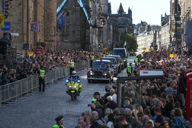 A convoy of cars with King Charles heads to Holyroodhouse. AP
