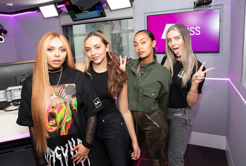 Jesy Nelson, in a colourful logo shirt, with her Little Mix bandmates, visits Kiss FM on February 04, 2019 in London