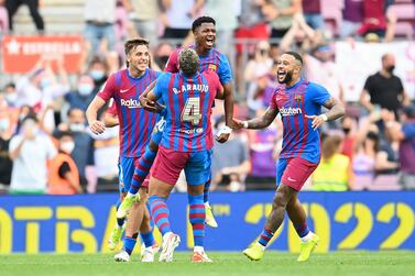 BARCELONA, SPAIN - SEPTEMBER 26: Ansu Fati of FC Barcelona celebrates with his team mates after scoring his team's third goal during the LaLiga Santander match between FC Barcelona and Levante UD at Camp Nou on September 26, 2021 in Barcelona, Spain. (Photo by David Ramos / Getty Images)