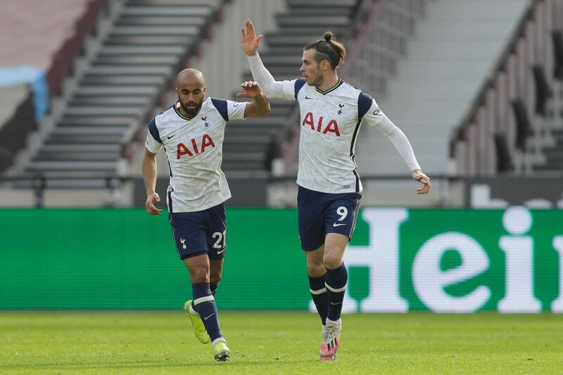 Tottenham Hotspur's midfielder Lucas Moura celebrates their first goal with Gareth Bale. AFP