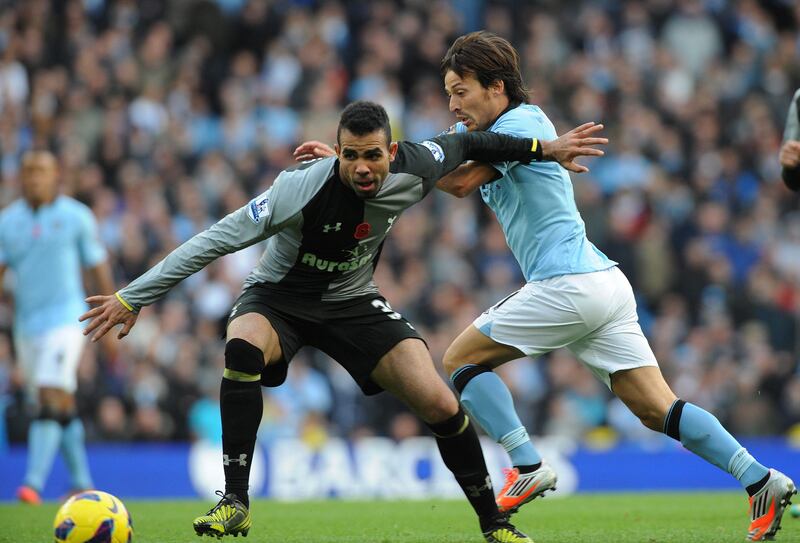 epa03467102 Tottenham's Sandro (L) vies for the ball with Manchester City's David Silva (R) during English Premier League soccer match at Etihad Stadium, Manchester, Britain, 11 November 2012.  EPA/PETER POWELL DataCo terms and conditions apply.  http//www.epa.eu/downloads/DataCo-TCs.pdf *** Local Caption ***  03467102.jpg