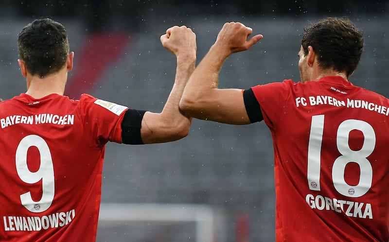 Bayern Munich's Leon Goretzka celebrates with Robert Lewandowski after scoring the opening goal against Eintracht Frankfurt. EPA