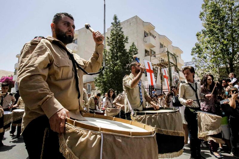 Boy scouts beat drums as they participate in a Palm Sunday procession in the Dwelaa area of Damascus. AFP