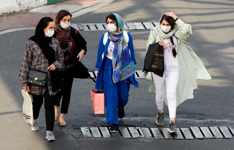 epa09143234 Iranian women wearing face masks walk on a street in Tehran, Iran, 18 April 2021. According to Iranian health ministry 405 people have died and more than 21.000 new infections were diagnosed from COVID-19 in past 24 hours as Iran is facing fourth wave of coronavirus pandemic.  EPA/ABEDIN TAHERKENAREH