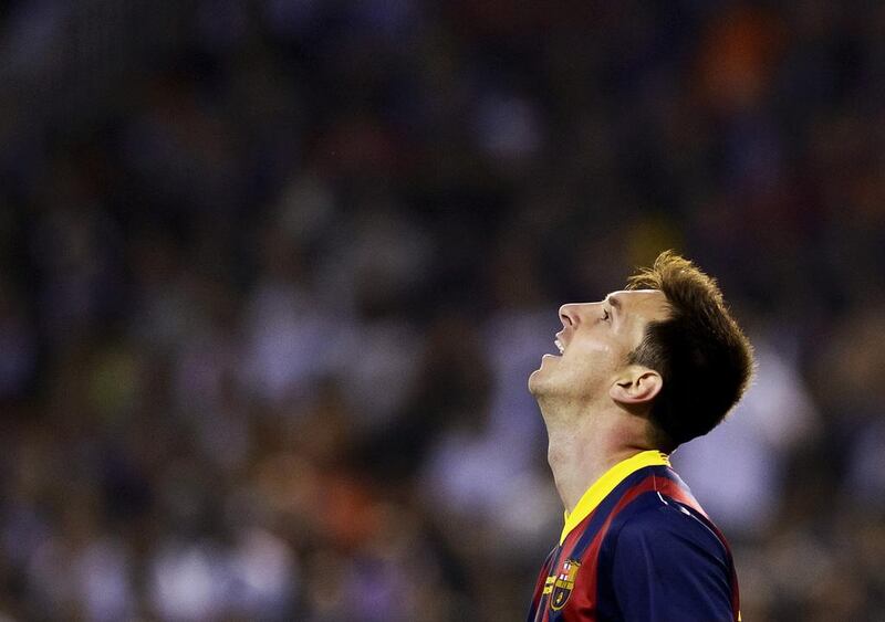 Barcelona forward Lionel Messi reacts during the Spanish Copa del Rey final against Real Madrid at the Mestalla in Valencia on April 16, 2014. Dani Pozo / AFP