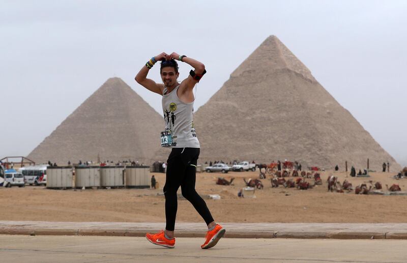 A runner participates in a marathon near the Pyramids of Giza, on the outskirts of Cairo, Egypt. Reuters