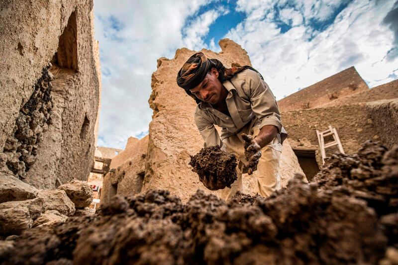 An Egyptian labourer works on the restoration of the fortress of Shali, in the Egyptian desert oasis of Siwa. AFP