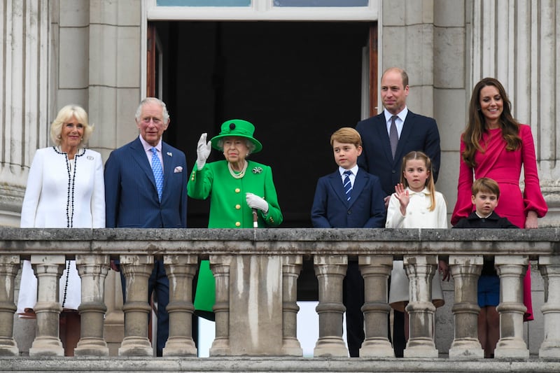 Camilla, Duchess of Cornwall, Prince Charles, Queen Elizabeth II, Prince George, Prince William, Princess Charlotte, Prince Louis and Catherine, Duchess of Cambridge stand on the balcony during the platinum jubilee pageant in June.