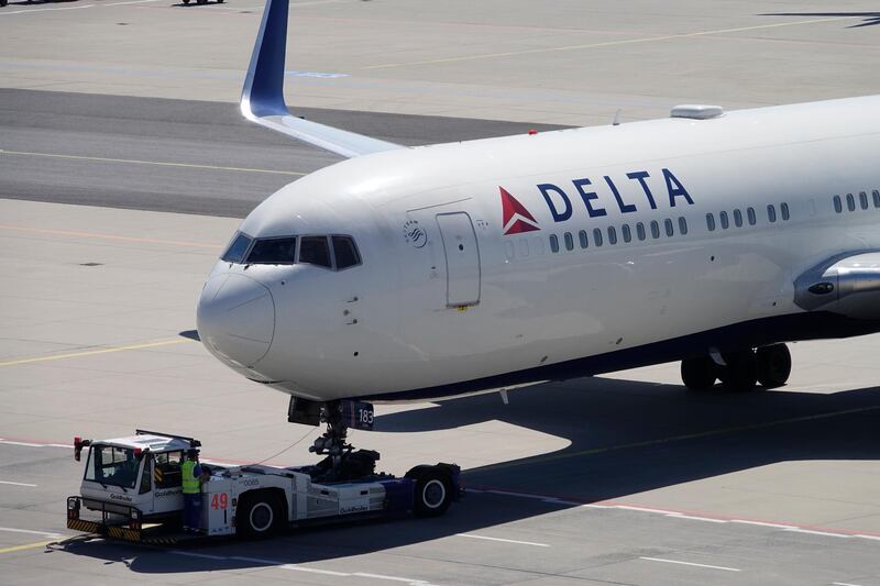 epa08937237 (FILE) - A Boeing 767-332 of Delta Air Lines is moved from the parking position prior to take-off at the Frankfurt airport, Germany, 08 May 2018 (reissued 14 January 2021). Delta Airlines on 14 January 2021 released their 2020 results saying their December quarter 2020 GAAP pre-tax loss stood at 1.1 billion USD and loss per share of 1.19 USD on total revenue of 4.0 billion USD, while December quarter 2020 adjusted pre-tax loss of 2.1 billion USD and adjusted loss per share of 2.53 USD on adjusted operating revenue of 3.5 billion USD. Full year 2020 GAAP pre-tax loss stood at 15.6 billion USD and loss per share of 19.49 USD on total revenue of 17.1 billion USD. Full year 2020 adjusted pre-tax loss was 9.0 billion and adjusted loss per share of 10.76 USD on adjusted operating revenue of 15.9 billion USD.  EPA/MAURITZ ANTIN *** Local Caption *** 54316176