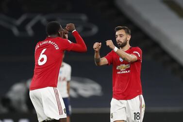 Manchester United's Bruno Fernandes (R) greets teammate Paul Pogba. EPA