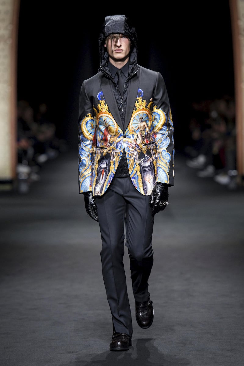 Versace: A sleek suit is transformed into a work of art with extravagant imagery on the tuxedo jacket. A shiny hooded jacket worn underneath keeps it fresh. Courtesy Versace