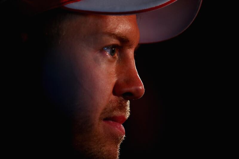 ABU DHABI, UNITED ARAB EMIRATES - NOVEMBER 25: Sebastian Vettel of Germany and Ferrari talks to the media after qualifying for the Abu Dhabi Formula One Grand Prix at Yas Marina Circuit on November 25, 2017 in Abu Dhabi, United Arab Emirates.  (Photo by Clive Mason/Getty Images)