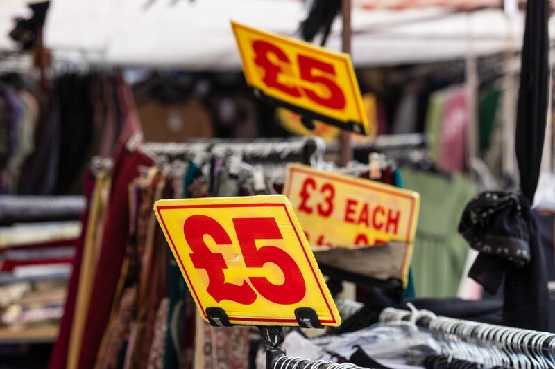 Clothing price labels at a market stall in London. Inflation fell to 3.4% in February from 4% the previous month. Bloomberg