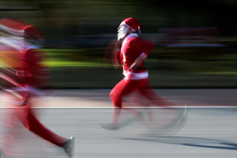 Participants dressed as Santa Claus take part in the annual race known as 'Run Santa Run' at Fundidora Park in Monterrey, Mexico. Reuters