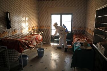 A member of the Syrian Civil Defence a makeshift hospital room in Dana, Syria, on March 22, 2020. AFP