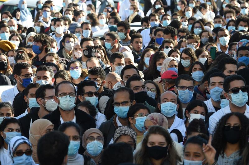 Tunisian doctors and medical students demand the dismissal of the minister of health during a protest in front of the headquarters of the ministry after the death of a resident doctor who fell from a broken hospital elevator.  AFP