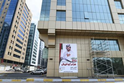 Abu Dhabi, United Arab Emirates - Poster of FNC member, Hazza Abu al Reesh displayed on a residence building in Abu Dhabi. Khushnum Bhandari for The National