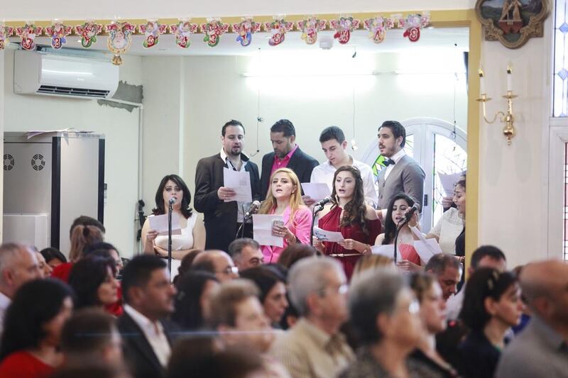 Parishioners listen to a choir during a mass at St. Michael's Catholic Church in Sharjah. Sarah Dea/The National